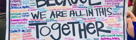 protest sign reading because we are all in this together